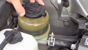 power steering fluid blowing out of cap