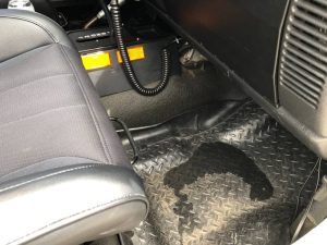 water on floor of car back seat when raining