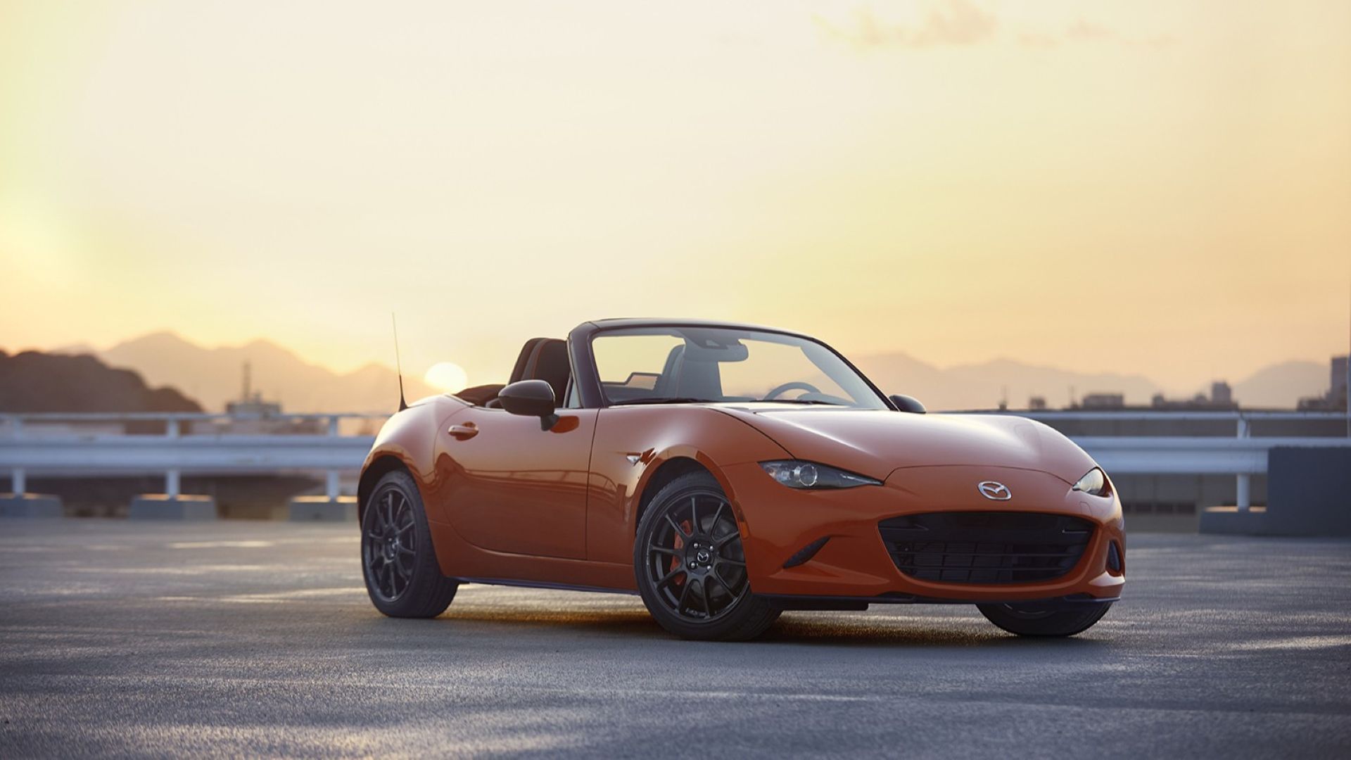 Mazda MX-5 Miata Orange Roof Down Front Angle