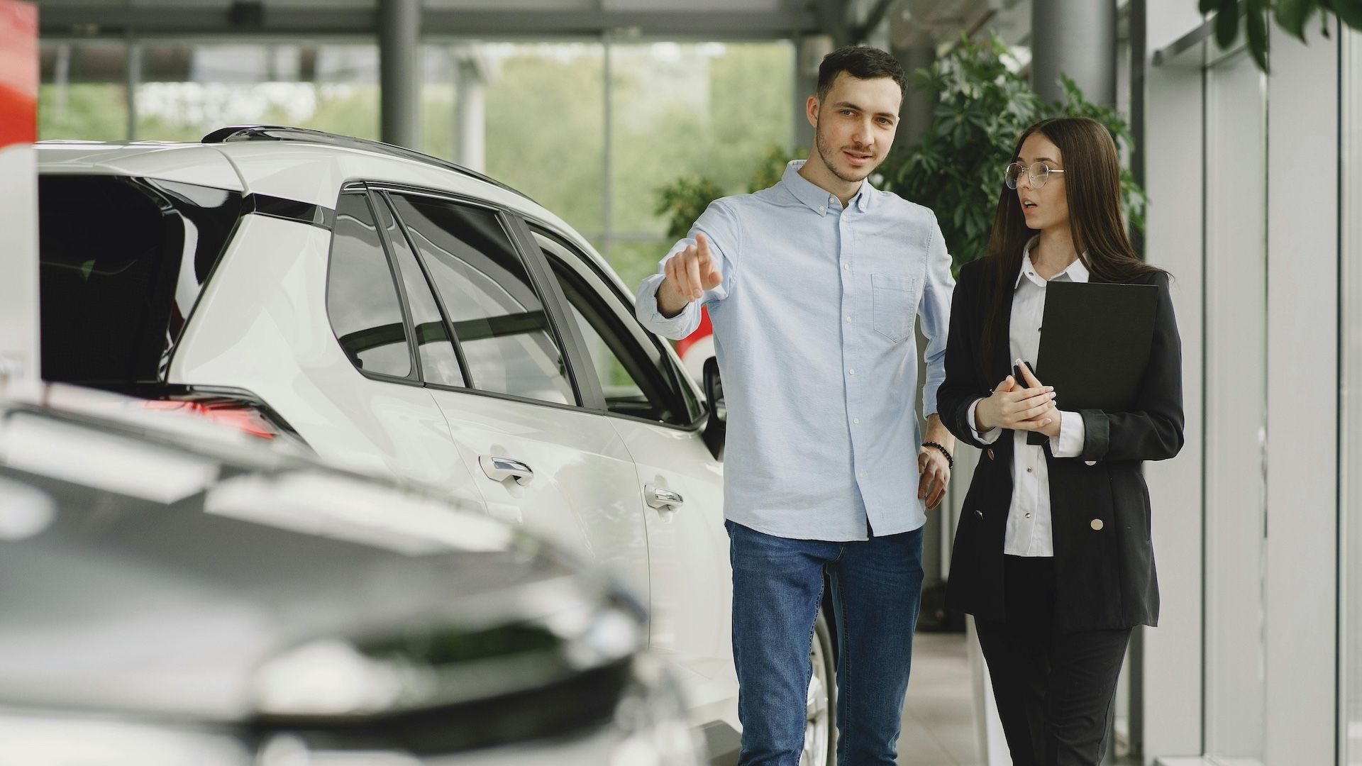 Car Dealership helping customer