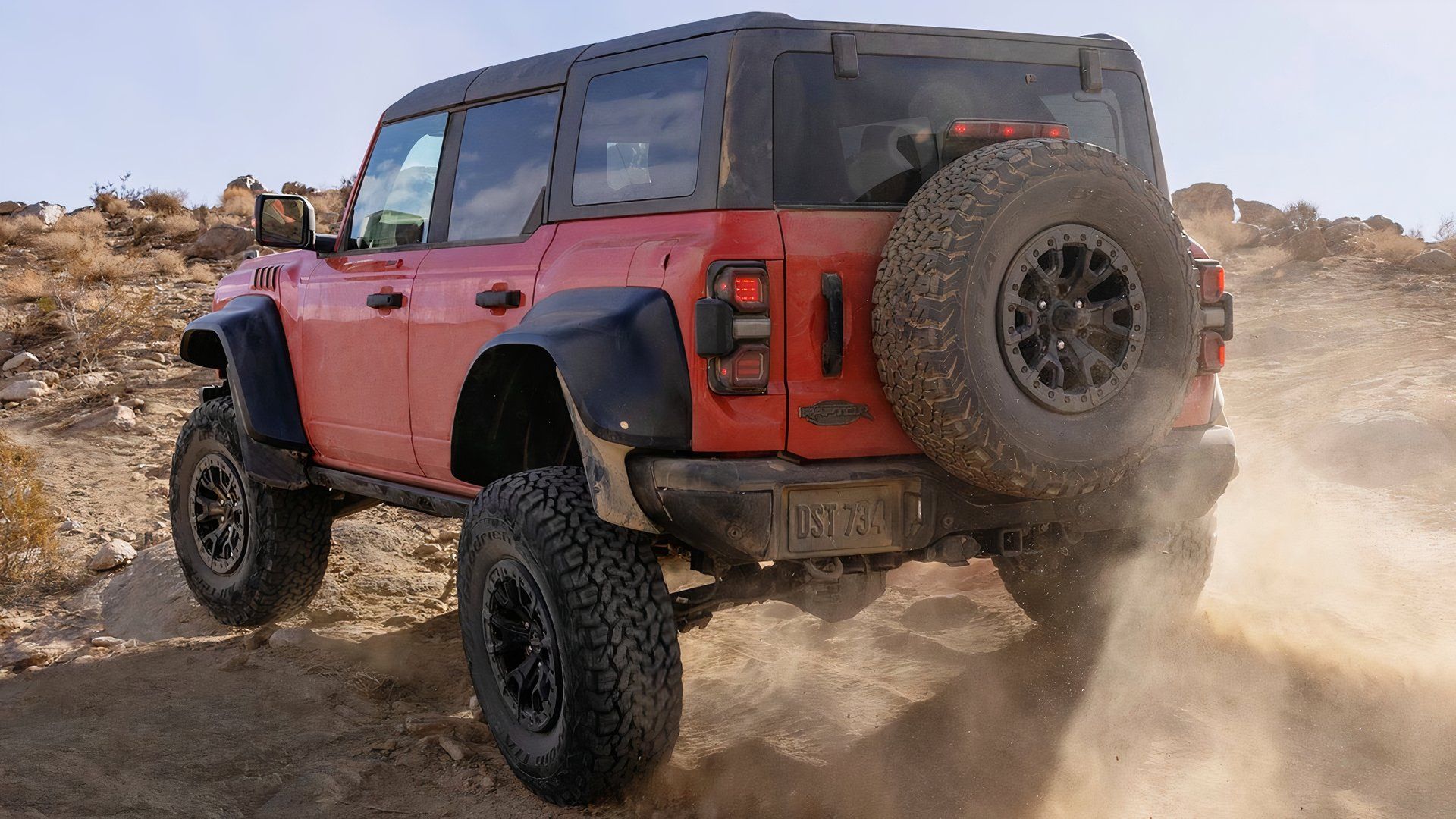 2022-2023 Ford Bronco Raptor Orange Rear Angle Off-Road Driving