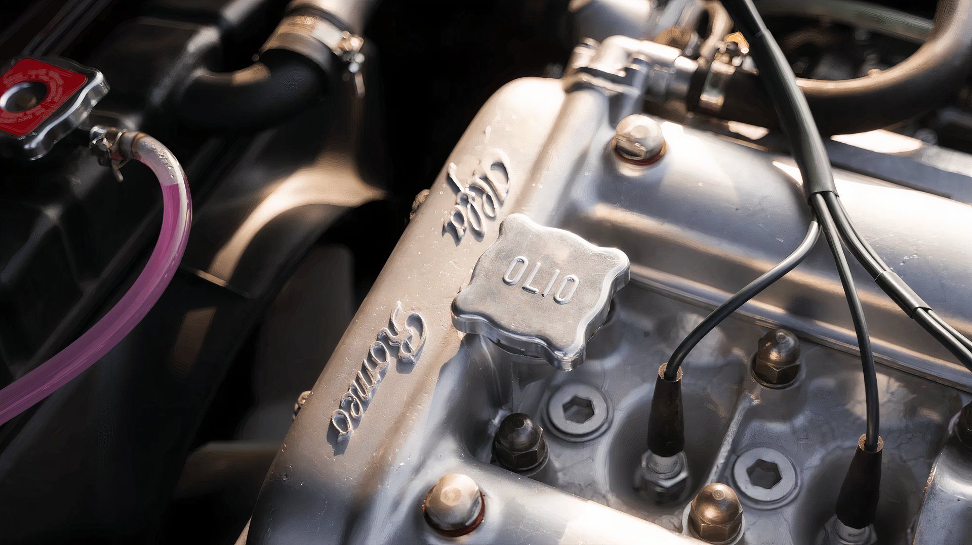 1973 Alfa Romeo GTV engine bay with 'OLIO' oil cap
