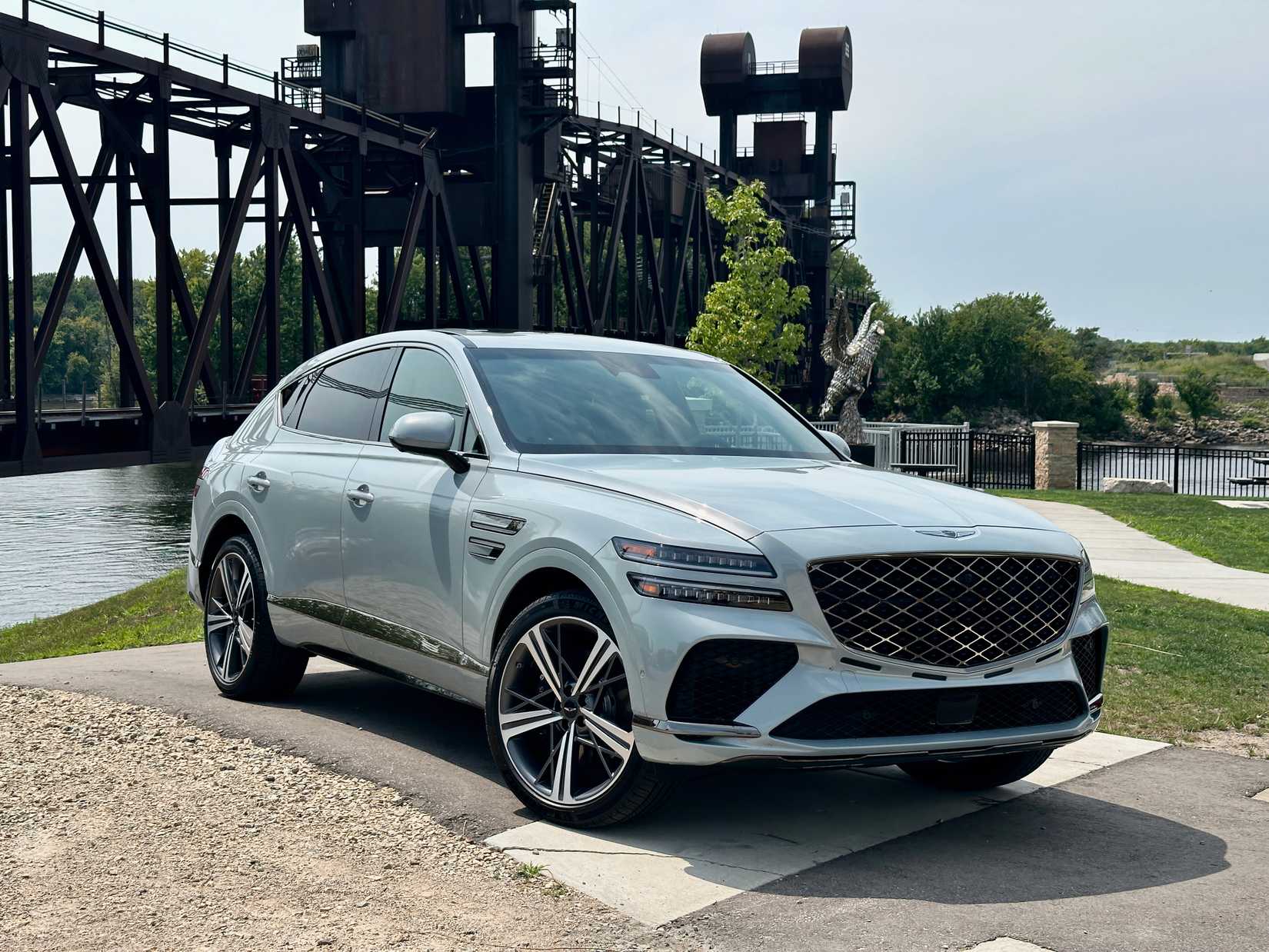 The 2025 Genesis GV80 Coupe parked by a bridge