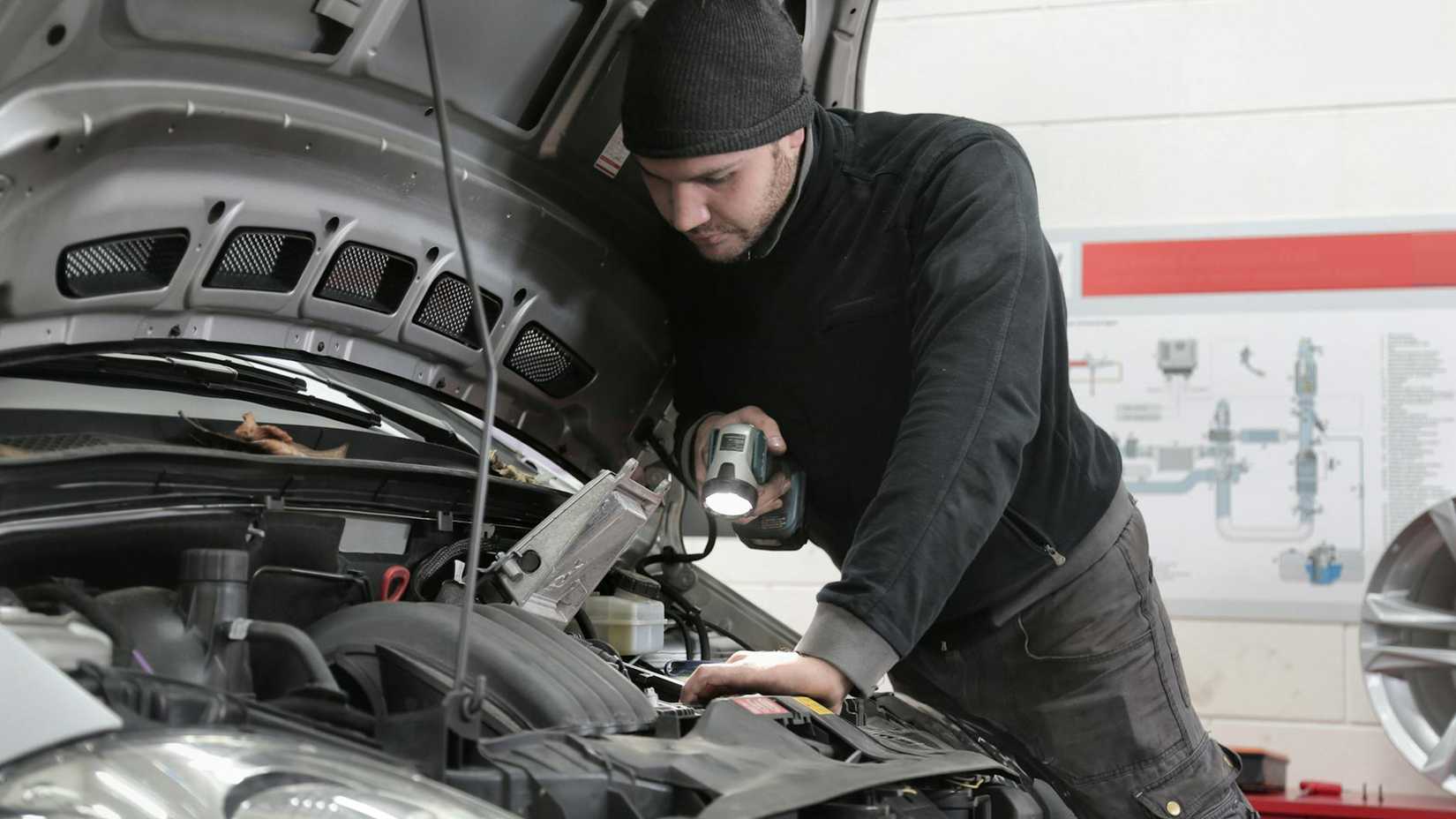 Mechanic checking car
