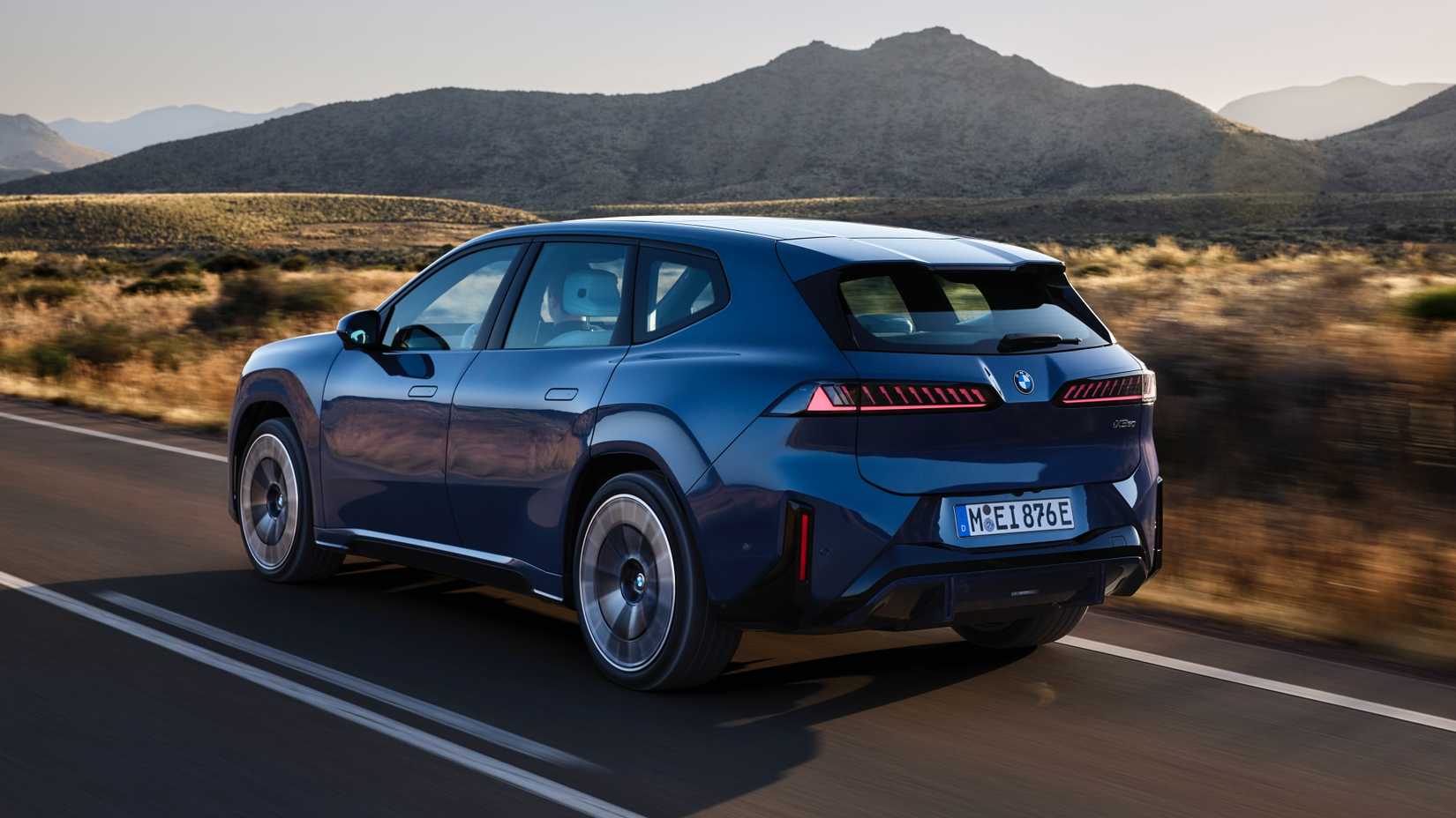 2027 BMW iX3 rear 3/4 driving