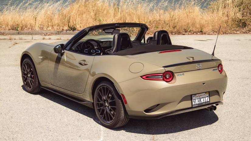 2024 Mazda MX-5 Miata Roof Down Gold Rear Angled View 3/4